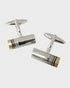 Pair of gold and black rhodium cufflinks on a white background