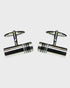 Pair of black rhodium cufflinks on a white background