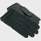 Pair of black gloves on a light gray background