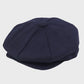Navy blue flat cap on a light gray background