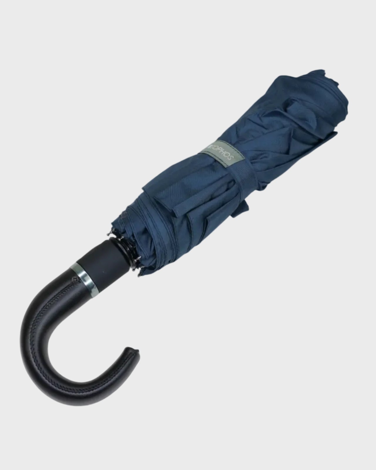 Blue umbrella with black handle on a light gray background