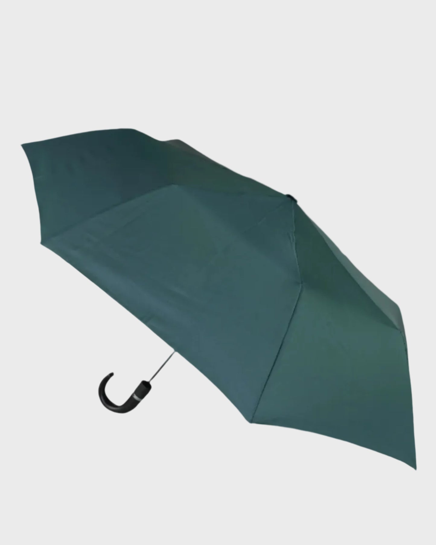 Green umbrella on a light gray background
