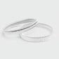 Silver armbands on a light gray background
