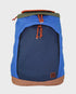A blue and navy backpack with orange drawstring cords, a brown base trim, and an olive green top flap, shown against a light gray background.