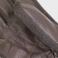 Close-up of brown leather gloves with a focus on the wrist area.