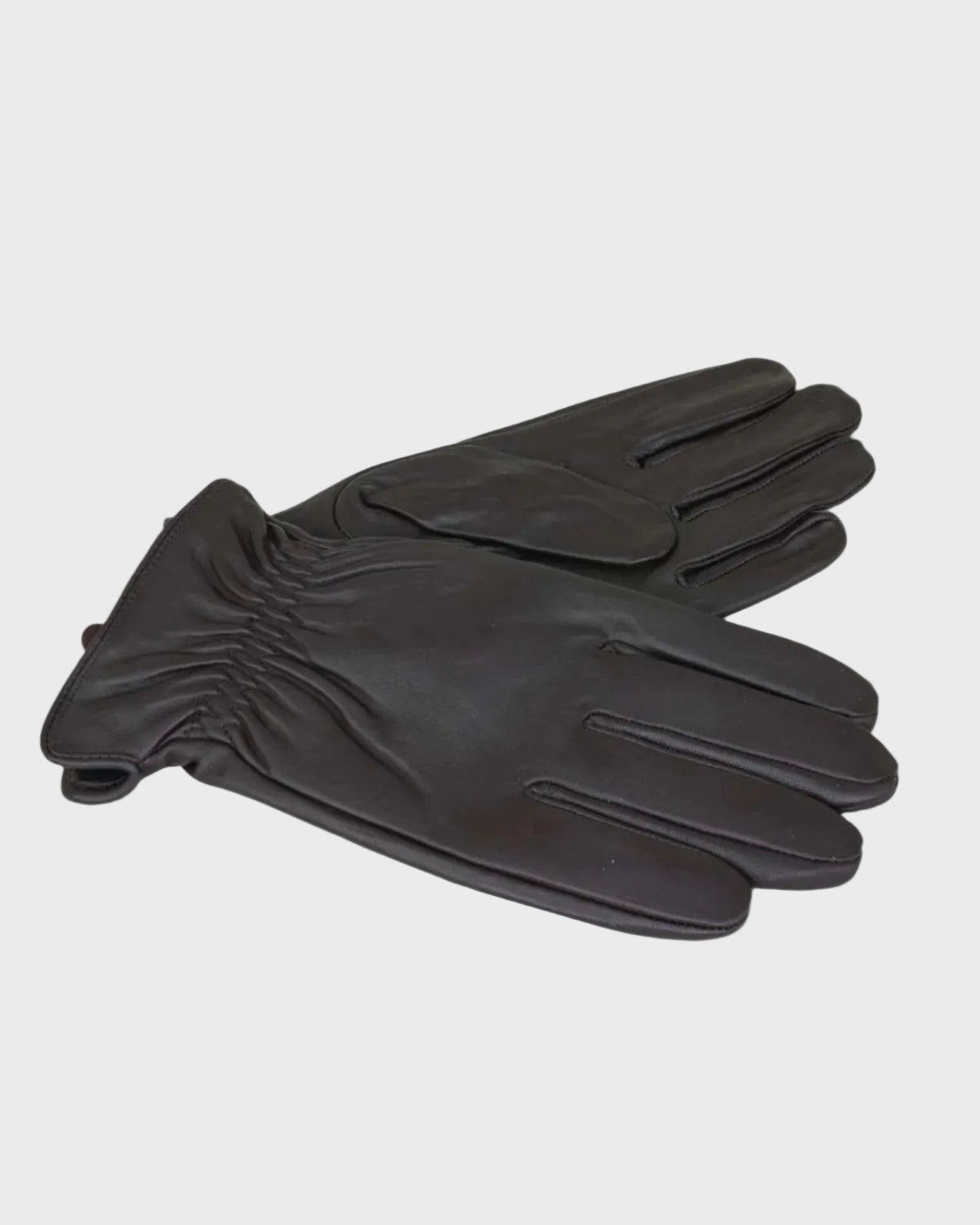Pair of leather gloves on a light gray background