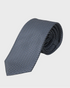 Patterned gray tie on a light gray background