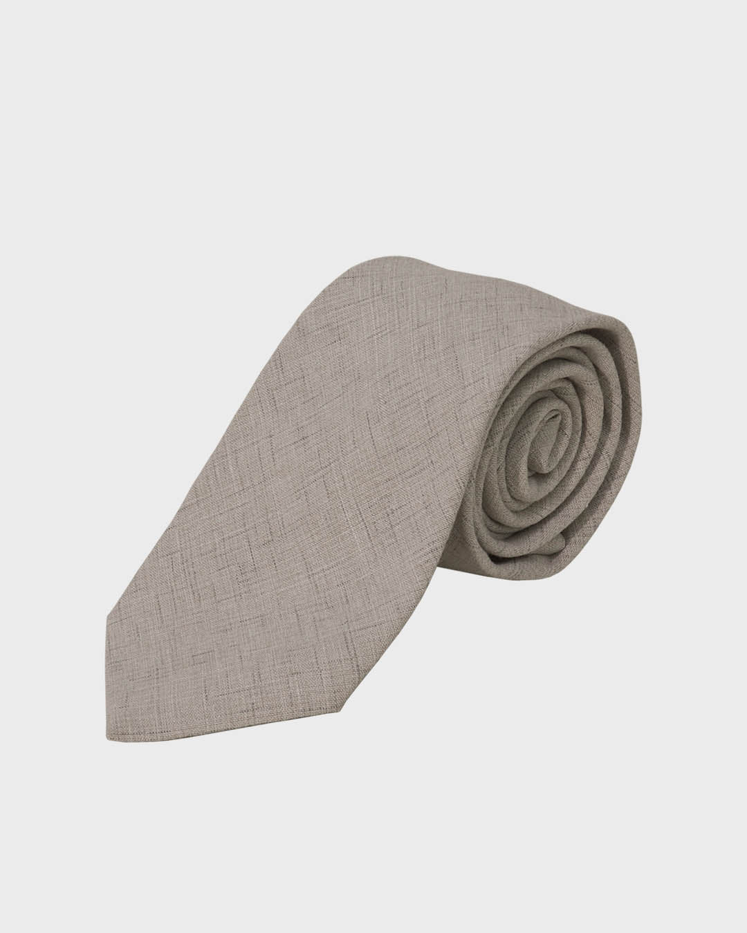 Folded beige tie on a light gray background