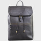 Black leather backpack with gold zipper on a light gray background