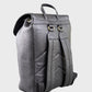 Black leather backpack on a light gray background