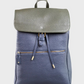 Two-tone backpack with a green top section and navy bottom section on a light gray background