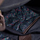 Close-up of a navy lining with heritage pattern and brown stitching