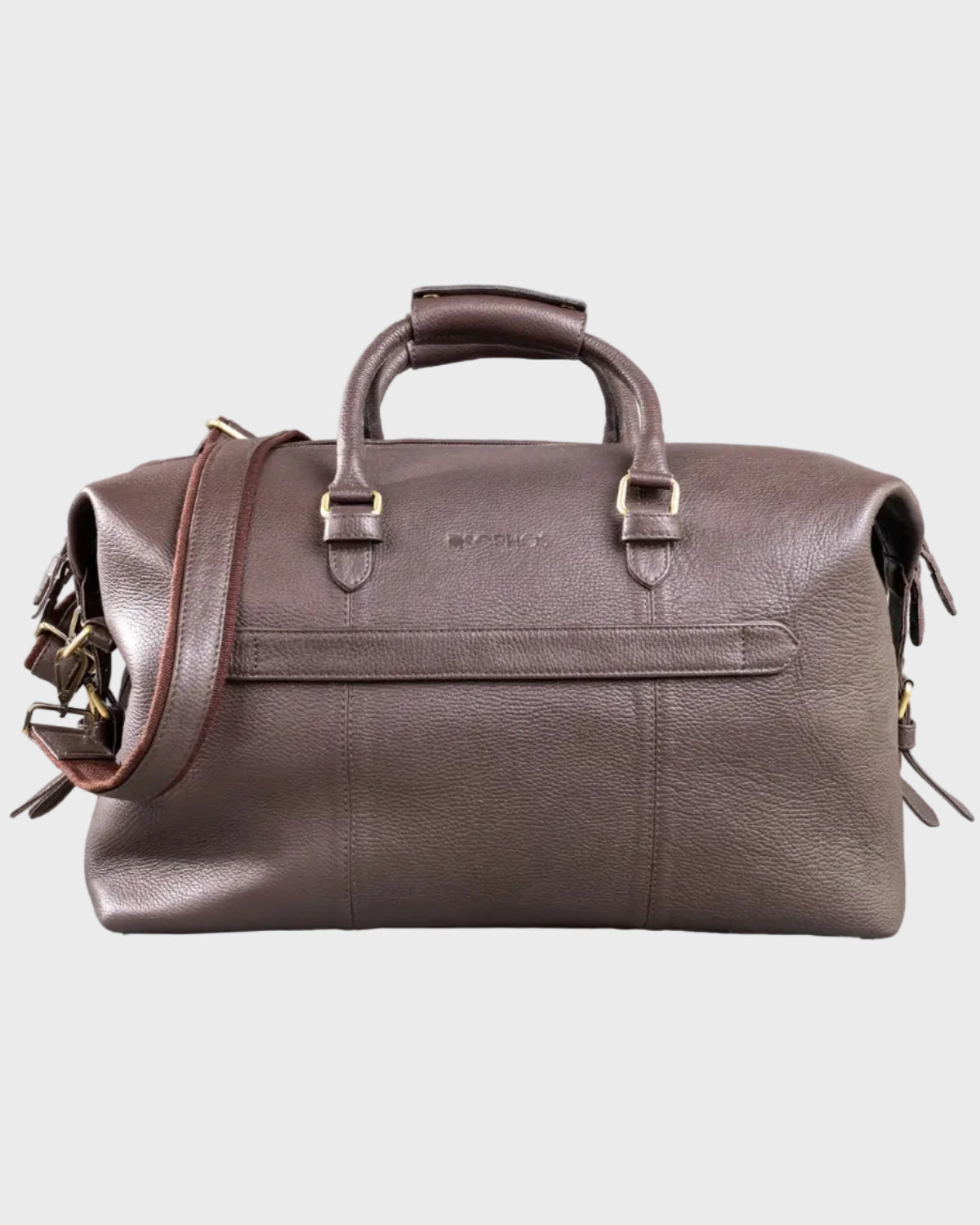 Brown leather holdall with shoulder strap on a light gray background