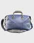 Navy leather holdall with gray straps on a light gray background