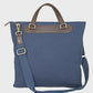 Navy bag with brown leather straps on a light gray background