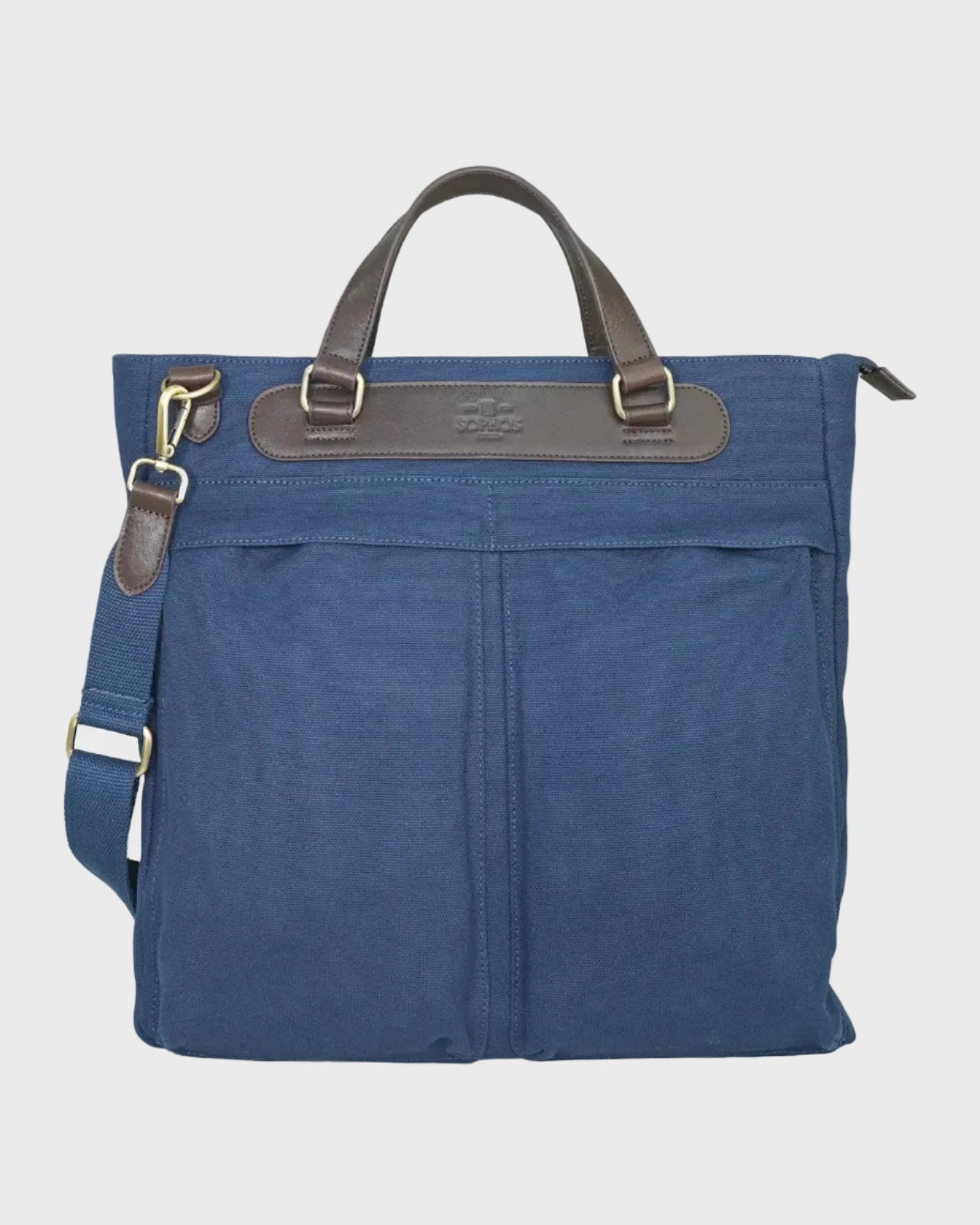 Navy bag with brown leather straps on a light gray background