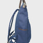 Navy backpack with brown straps on a light gray background