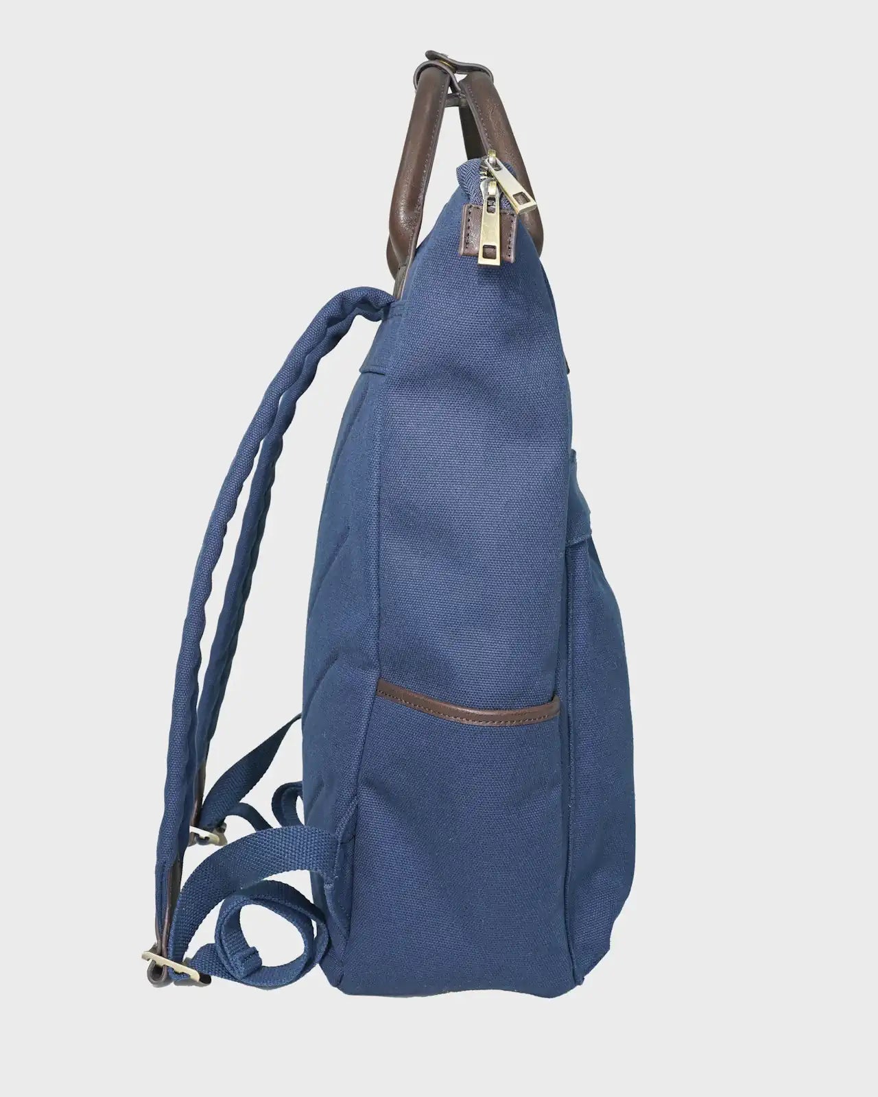 Navy backpack with brown straps on a light gray background