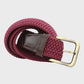 Burgundy woven belt with a brass buckle on a light gray background