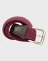 Burgundy woven belt with a brass buckle on a light gray background