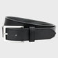 Black leather belt with silver buckle on a light gray background