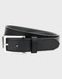 Black leather belt with silver buckle on a light gray background