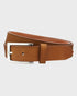 Tan leather belt with a silver buckle on a light gray background