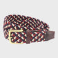 Woven belt with a brass buckle on a light gray background