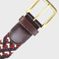 Woven belt with a brass buckle on a light gray background
