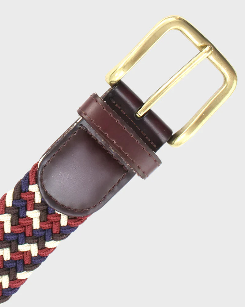 Woven belt with a brass buckle on a light gray background