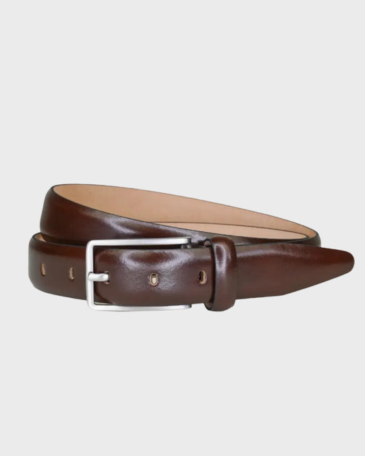 Brown leather belt with a silver buckle on a light gray background