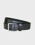 Black leather belt with a silver buckle on a light gray background