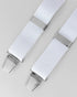 White braces with silver clips on a light gray background