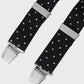 Black polka dot braces with silver clasp on a light gray background
