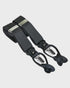 Black braces with silver clips on a light gray background