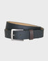 Navy belt with a silver buckle on a light gray background
