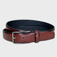 Tan leather belt with silver buckle on a light gray background