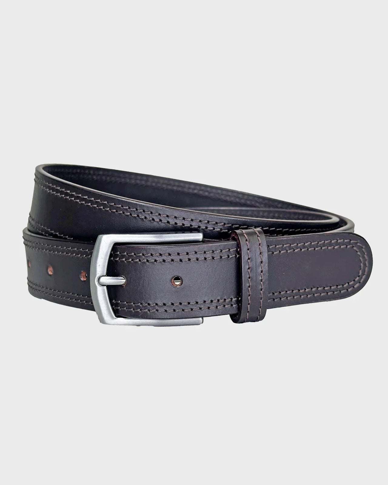 Brown leather belt on a light gray background