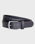 Brown leather belt on a light gray background