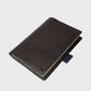 Dark brown leather notebook on a white background