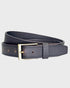Brown belt with a brass buckle on a light gray background