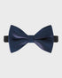 Navy blue bow tie on a light gray background