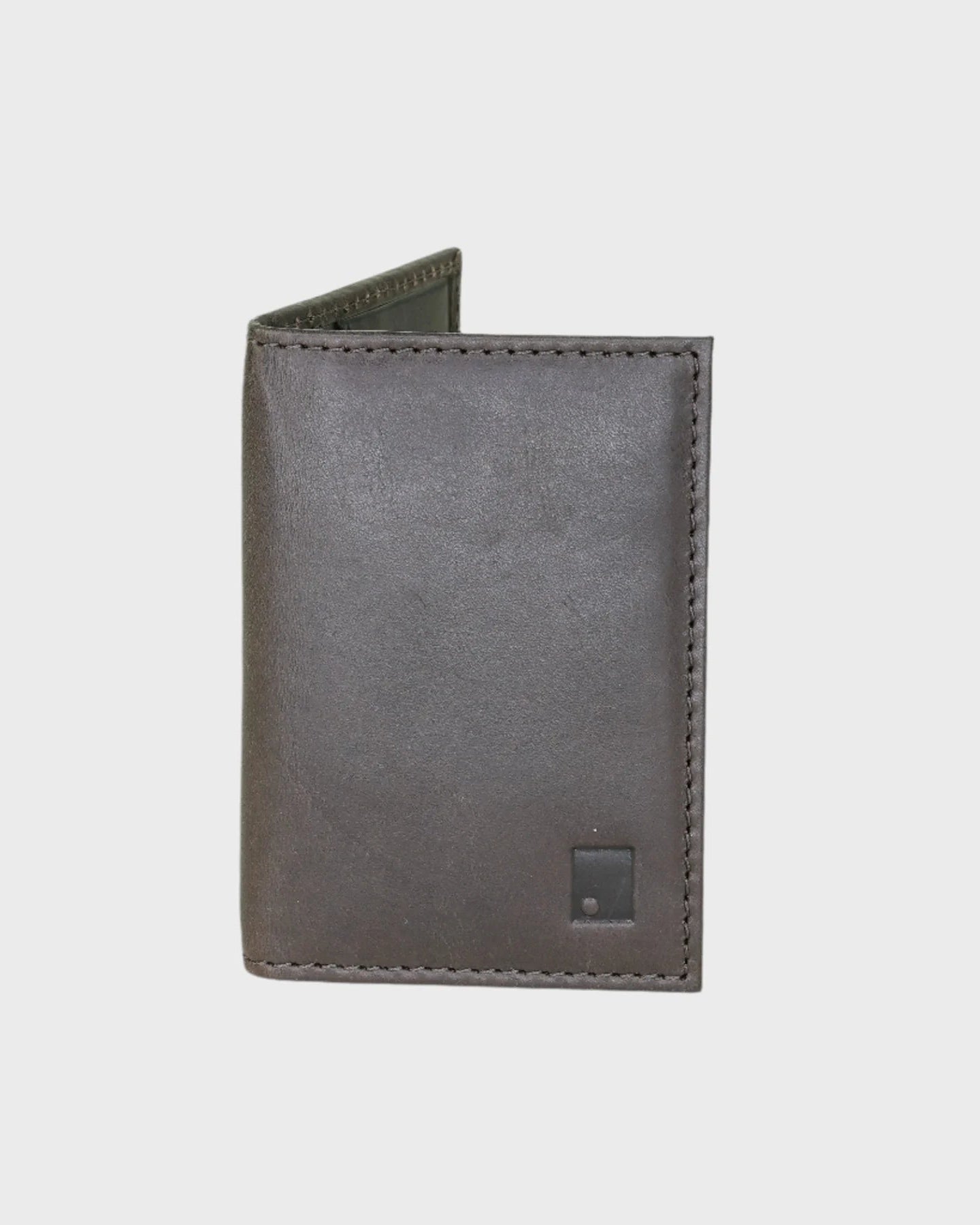 Brown leather wallet on a light gray background