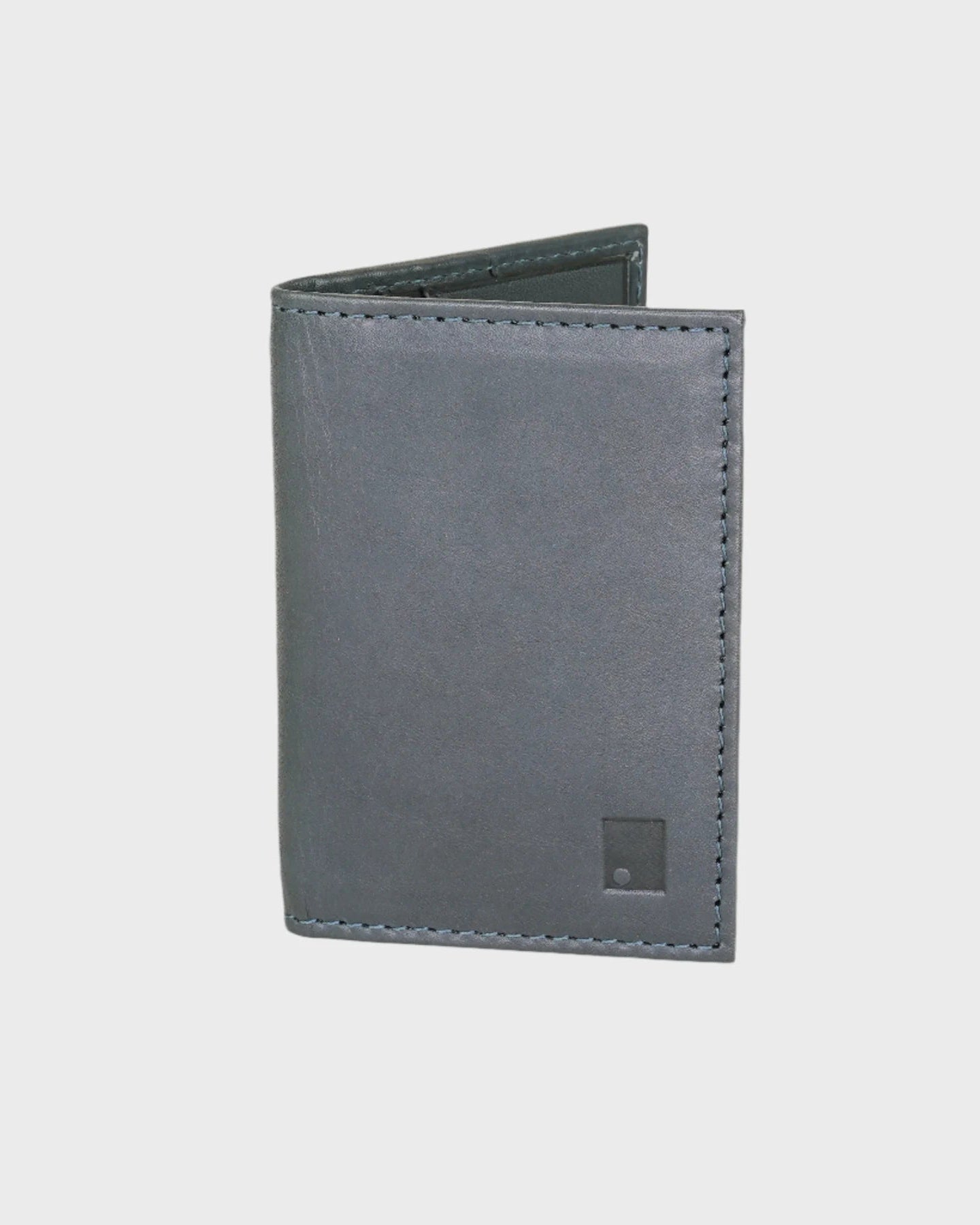 Navy leather wallet on a light gray background
