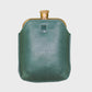 Green leather flask on a light gray background