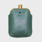 Green leather flask on a light gray background