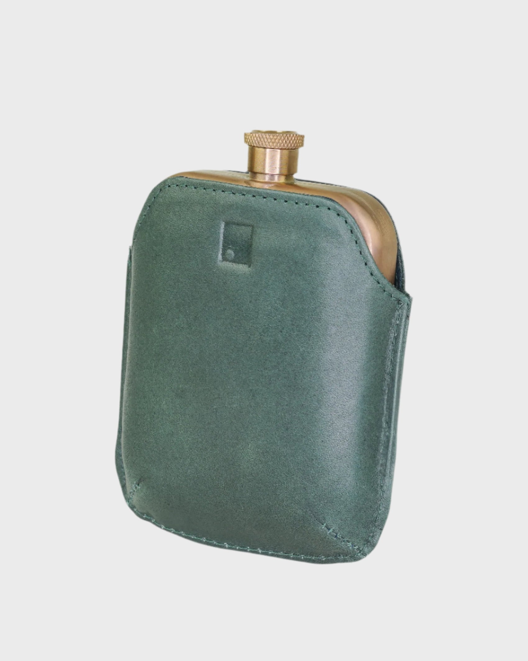Green leather flask on a light gray background