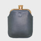 Navy leather flask on a light gray background