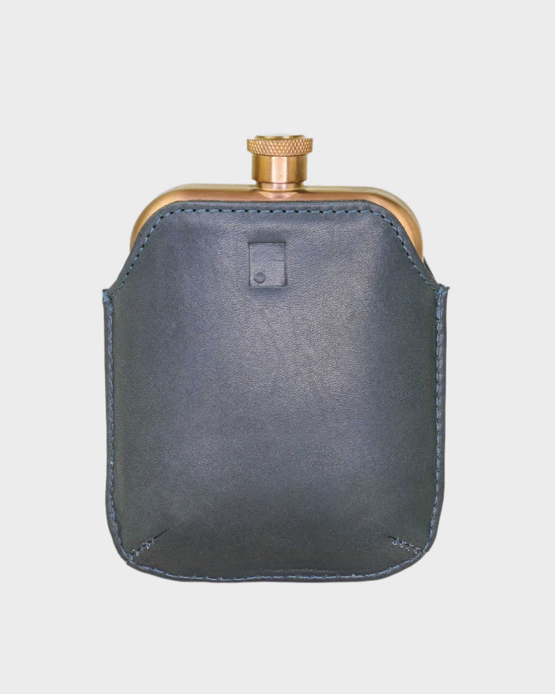 Navy leather flask on a light gray background