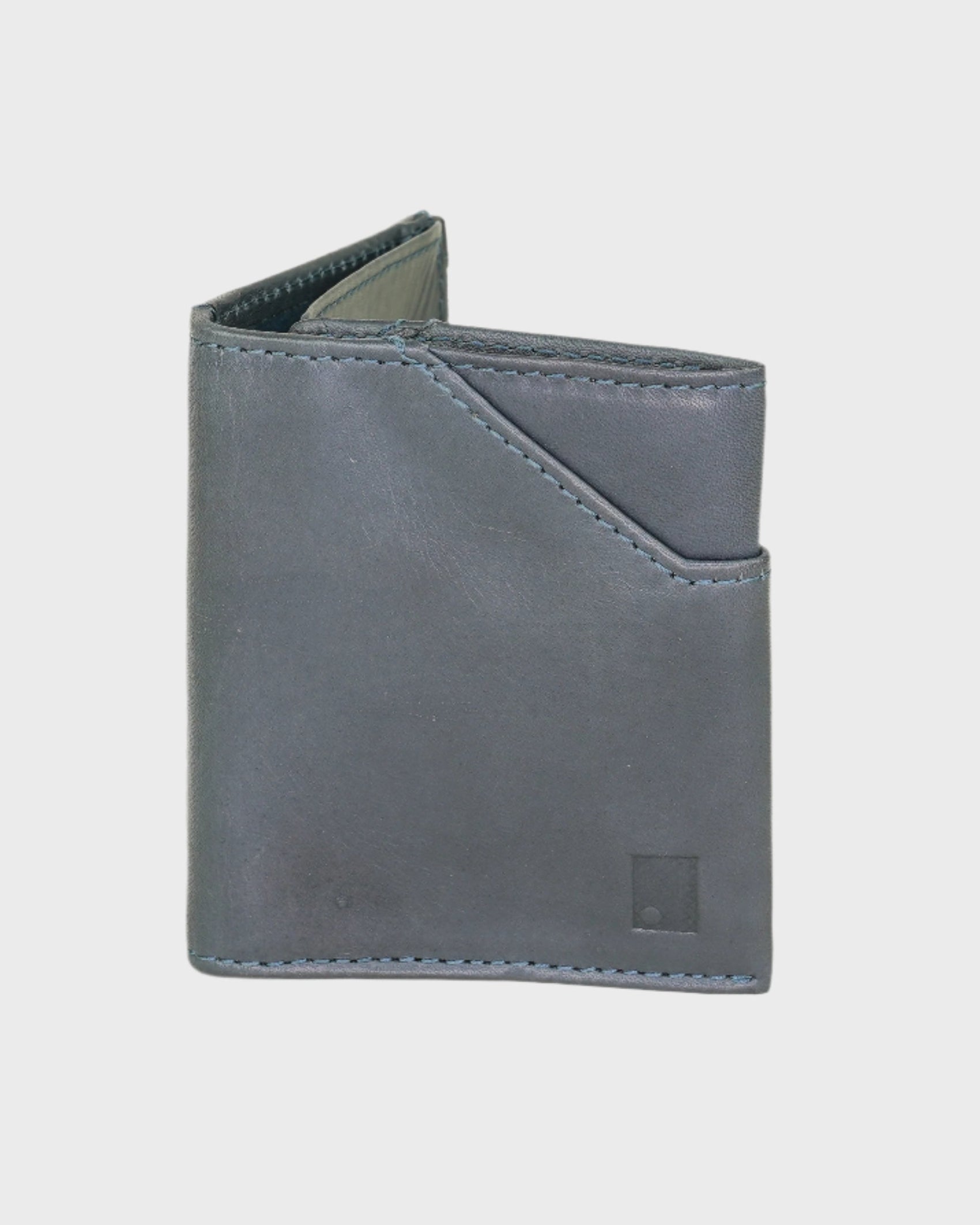Navy leather wallet on a light gray background